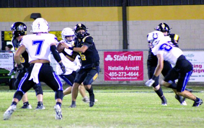 Tecumseh sophomore Maddox Dickson looks to pass during the home game with Bethany, Oct. 12. The Savages lost, 14-49. Countywide &amp; Sun/Natasha Dunagan