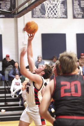 Asher's Greyson Wood brings it to the basket during the Jan. 16 home game against Vanoss. The Indians won 65-55.