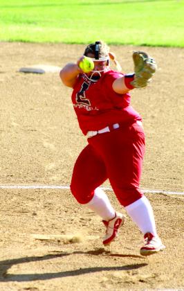 Abby McAlister goes airborne with her fast pitch during the first inning.
