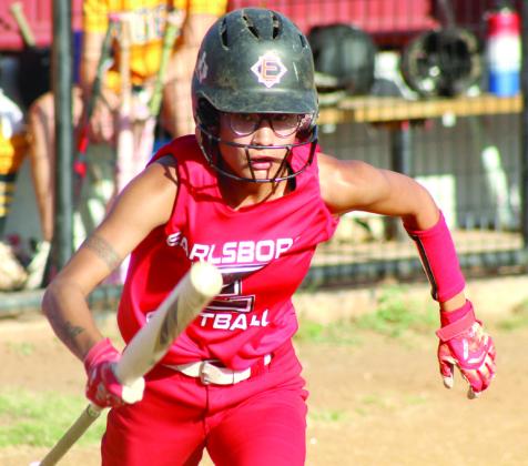 Molli Bustos runs to first base on a walk.