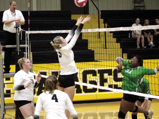 Tecumseh senior Audrey Moles jumps up to block the ball during the home game against Seminole on Aug. 18. The Lady Savages won all three of their matches: 25-19, 25-14, and 25-11. Countywide &amp;amp; Sun/Natasha Dunagan