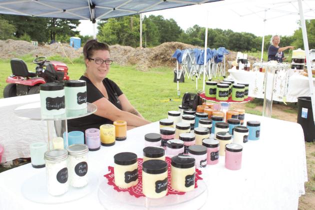 Lynn McRae offers sugar scrubs and lead crystal suncatchers at Hoke Hollow Farmer’s Market on July 21. McRae home schools her three children, so being a vendor is a summer venture.