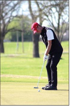 North Rock Creek freshman Caiden Wiles putts during the Tecumseh Boys Golf Invitational at Fire-Lake Golf Course on April 13.