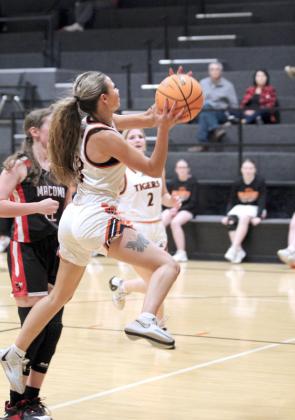 Maud’s Janlee Impson flies toward the hoop, but is fouled during the Dec. 9 home game with Macomb.