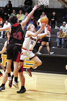 Maud’s Zane Reinhardt tries for a layup during the Dec. 9 home game with Macomb. The Tigers won, 72-64. Countywide &amp; Sun/ Natasha Dunagan