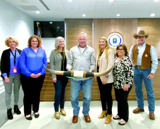 Elected officials wish Dist. 2 Pottawatomie County Commissioner Randy Thomas well on his retirement. Dist. 1 Commissioner Melissa Dennis presented Thomas with a set of longhorns. Pictured from left are Assessor Leona Satterfield, Court Clerk Valerie Ueltzen, Dist. 3 Commissioner Abby Thompson, Thomas, Dennis, Election Secretary Patricia Carter, and Sheriff Mike Booth. File Photo