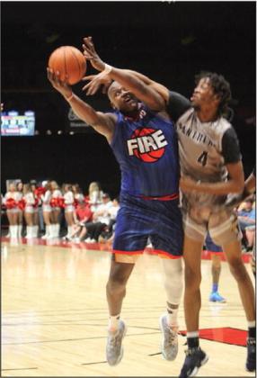 Potawatomi Fire Forward/Center Paul Harrison tries to aim for the basket but is fouled during the home game against the Oklahoma Panthers, April 13. The Fire won, 128-90. Countywide &amp;amp; Sun/Natasha Dunagan
