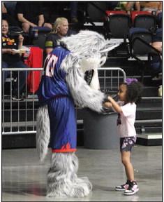 Mo, the Fire Wolf, dances with Skylar Harrison, 3, of Atlanta, GA, during the Potawatomi Fire home game on April 13. Harrison is the daughter of Fire Forward/Center Paul Harrison. Countywide &amp;amp; Sun/Natasha Dunagan