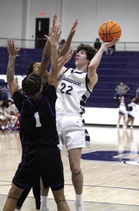Shawnee sophomore Edan Litherland shoots over two Southeast defenders during the Shawnee Invitational game on Jan. 23. The Wolves beat Southeast, 68-45; lost to Mustang on Jan. 24, 42-47; and fell to Choctaw on Jan. 25, 46-65. Countywide &amp; Sun/Natasha Dunagan