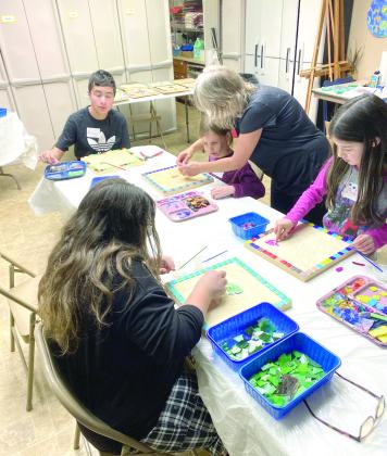 Kids work on mosaics during an art class at the Mabee-Gerrer Museum of Art. Photo provided