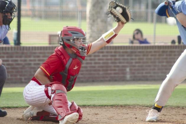 Dale senior Ethan Douglas reaches for the catch during the first inning of the Aug. 18 Arapaho-Butler game. Dale won, 10-0. Countywide &amp; Sun/Natasha Dunagan