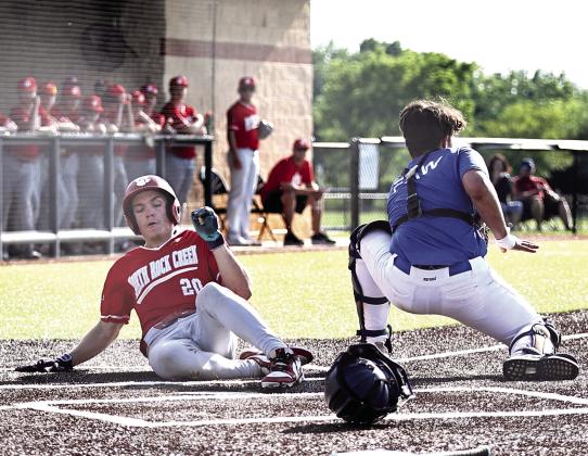 Hunter Bertram is safe at home for a score against Bridge Creek on May 26.