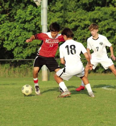 McLoud's Kristian Lujan maneuvers around the Crossings Christian defense during the April 16 home soccer match. The Redskins lost 0-7. Photos by Natasha Dunagan, Countywide &amp; Sun