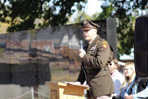Lt. Col. Jakim Finlay, OK Army National Guard Commander of 1-179 Infantry Battalion, speaks about the late Major Cecil Johnson during the Pottawatomie County Veterans Memorial and Museum Veterans Day Program, held at the Woodland Veterans Park on Nov. 11. Countywide &amp; Sun/Natasha Dunagan