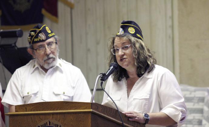 American Legion Post #260 Vice Commander &amp; Adjutant Renee Clemmons speaks during the Flag Day Celebration and Flag Retirement at the Tecumseh post on June 15. Listening is Post Financial Officer William Gammage, left.