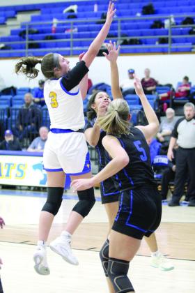 Bethel junior Alexis Tucker tries for two and draws a foul.
