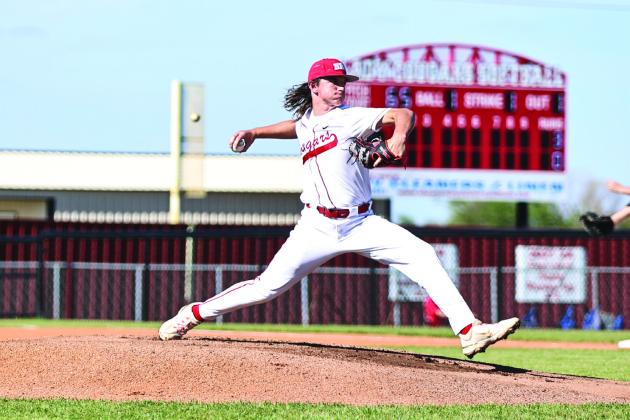 North Rock Creek’s Landon Kelough puts everything into the pitch. NRC Beat Henryett 10-0 and Kelough was the winning pitcher.