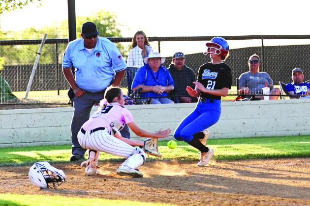 Sophie Morris makes the tag at home plate, for one or her two outs. The Lady Cougars won their first game against Haskell, 11-1. The team came from a 1-7 deicit in the third to beat Moore 12-11.