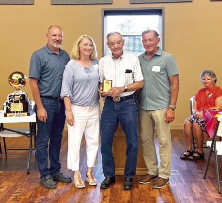 George Flewallen (pictured third from left) received one of two Dale Pirate Pride awards during the annual banquet held Saturday. Pictured with Mr. Flewallen are his children (from left) Troy Flewallen, Terri Flewallen, and Jimmy Flewallen.
