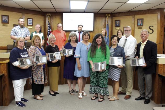 Retirees from Shawnee Public Schools were honored with a reception before the Shawnee Board of Education regular meeting on May 14, and they also received a clock. Shown, from left, are Debra Watson, Beth Mills, Angela Lindsay, Terri Mastin, Dana Boyer, Mary Cash, Laura Brandherm, Randy Lauderdale and Ray Shaffer. Countywide &amp; Sun/Natasha Dunagan