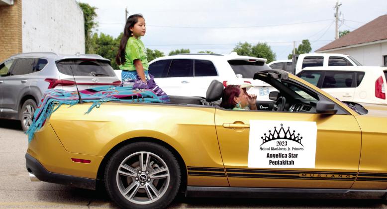 The 2023 McLoud Blackberry Jr. Princess Angelica Star Pepiakitah rides in the Blackberry Festival parade.