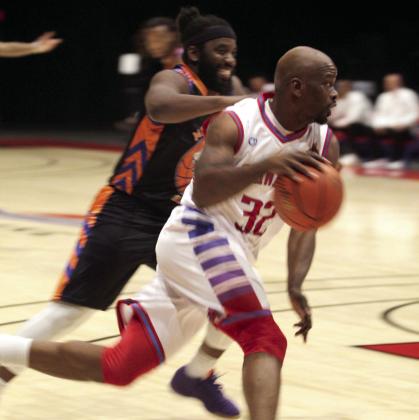 Potawatomi Fire guard Willie Warren drives to the hoop before adding two points to the board.