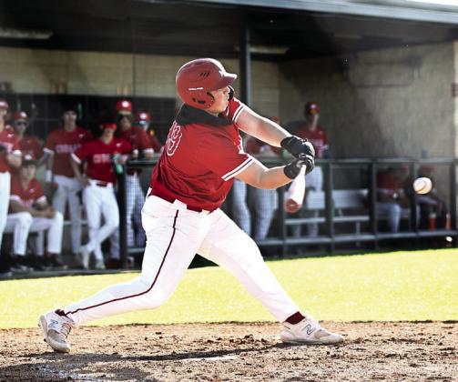 Pictured right, North Rock Creek’s Cooper Ford swings for a base hit. Photo courtesy of Gowin Photography
