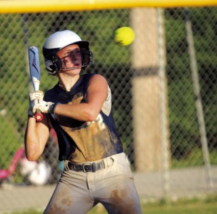Asher sophomore Makenah Templeton watches a ball as it flies by too close in the fourth inning of the Aug. 19 home game with Tupelo. The Asher Lady Indians won, 3-1.