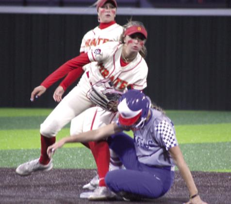 Dale junior Holland Herring steadies herself as a Silo runner slides into threw for a double play.