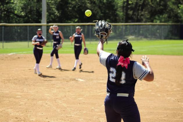 Asher freshman Raina Timms makes the catch at first base ahead of the runner during the Class B District home game against Achille on April 22. Natasha Dunagan, Countywide &amp; Sun