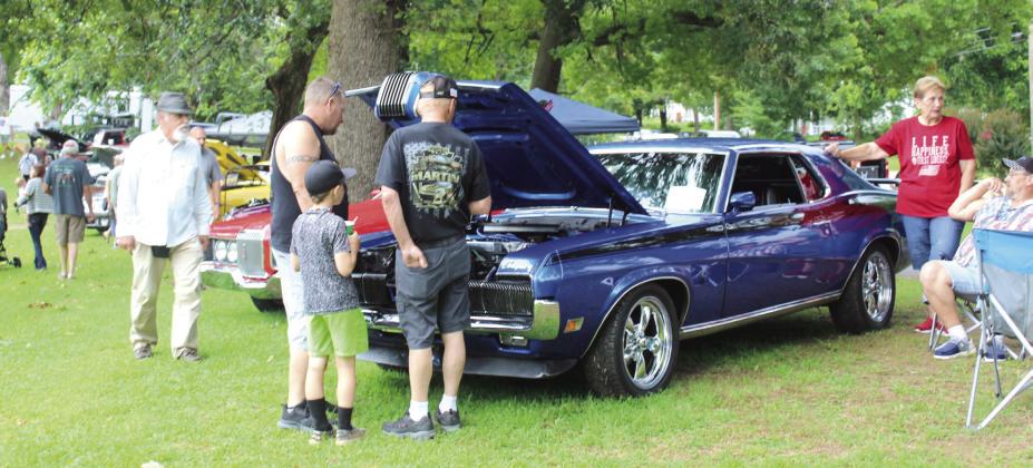 With its growling horn, this 1970 Mercury Cougar attracted attention. It is owned by Jeff Wiley of Tecumseh, far right, who said he and his son Chance Wiley have worked on it for 10 years. C. Wiley owns the red 1971 Cougar Convertible behind his father's blue car. Natasha Dunagan, Countywide &amp;amp; Sun