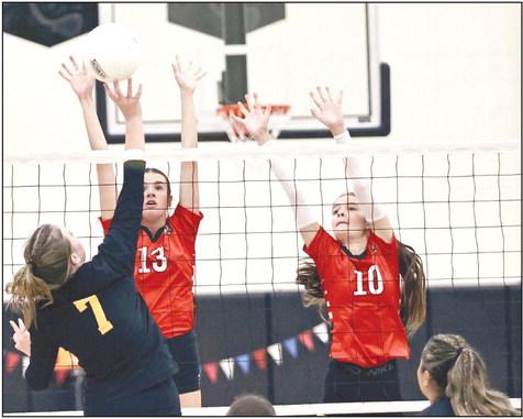 North Rock Creek’s Chloe Kasterke &amp;amp; Brianna Ogden block a shot.