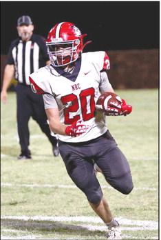North Rock Creek’s Clavin Bray carries the ball for a 1st down. The Cougars lost their game against Holdenville High School by a score of 15-34.
