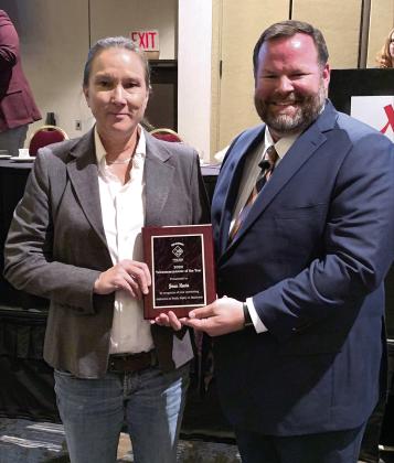 CPNPD dispatcher Joan Nevin accepts the Telecommunicator of the Year award for her exceptional focus and calm demeanor on the job. (Photo provided)