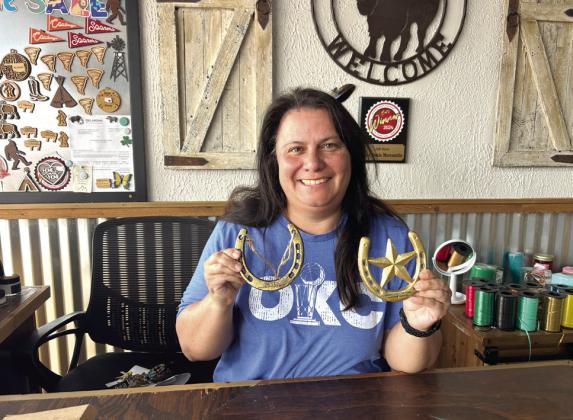 Okie Dokie Mercantile won the Paint the Town Western IFYR Best Western Window Display and was chosen as the Overall Paint the Town Western Champion. Pictured holding the Golden Horseshoe awards is owner Christina Hernandez. Suzie Campbell, Countywide &amp;amp; Sun
