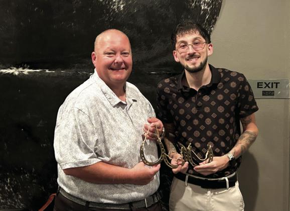 Paul's Place received three awards in the first annual Paint the Town Western IFYR event. Owner Dell Kerbs (left) and General Manager Trevor Price took a minute to pose with their Golden Horseshoe awards for Best Restaurant Spirit, Best Employee Participation, and Best Customer Welcome. Suzie Campbell, Countywide &amp;amp; Sun