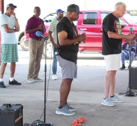 Shawnee Mayor Ed Bolt reads a proclamation for Juneteenth during the Juneteenth Prayer Service, held at the pavilion on Bell and 7th streets, in Shawnee,  June 18. Standing by him is Timmy Young, President of the Dunbar Heights Community. Also shown are pastors Joe Wilkes, David Henry, and Vincent Roland. This was the second year that Juneteenth was a federal holiday, although it has been celebrated since 1866.
