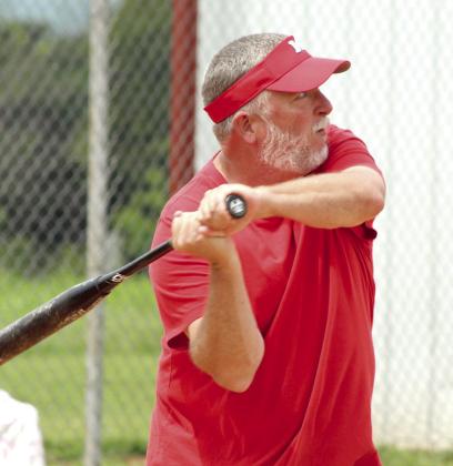 Elementary Teacher and Middle School Head Boys Basketball Coach Aaron Norton takes his turn at bat.