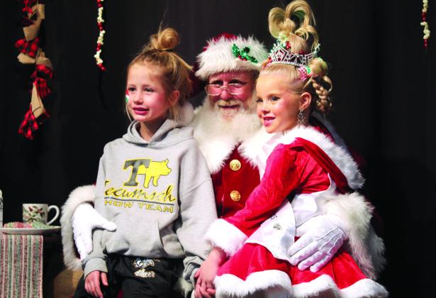 Frontier Days Pageant buddies Kate Benge and Miss Tot Frontier Days Autumn Hughes pose with Santa in Whoville, held in the Tecumseh City Hall Auditorium on Dec. 5. Countywide &amp; Sun/Natasha Dunagan