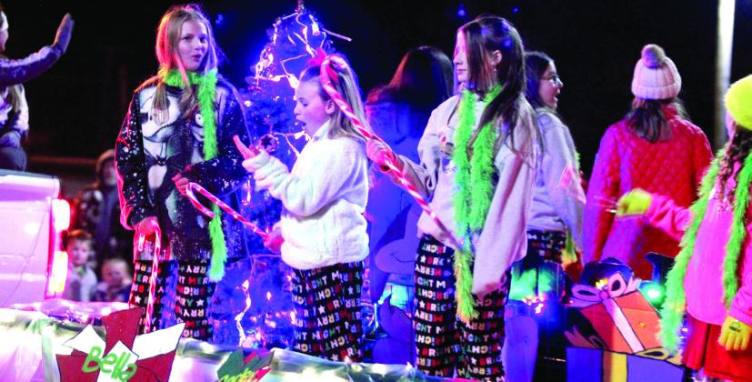 A group of girls has fun riding on a float in the Grinchmas parade in Tecumseh on Dec. 5. Countywide &amp; Sun/Natasha Dunagan