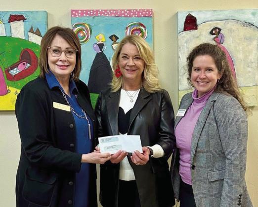 Kathy Laster, Ph.D., President and CEO of Avedis Foundation, presents a check for $15,000 to Miki Farris, Executive Director of Infant Crisis Services, and Allison Parker, Director of Development &amp;amp; Communications of Infant Crisis Services. Photo provided.