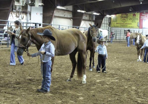 Ransom Parsons, 9, and Raykin Parsons, 4, both of Earlsboro, show in the Senior Geldings division of the Pottawatomie County Free Fair Horse Show on Sept. 6. Ransom placed fifth with his horse Cowboy, out of 11 entries. The judge for the horse show was Jaclyn Sturgeon.