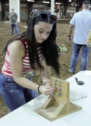 Chloe Lorentz of Bethel races against the clock in the bolt block competition.