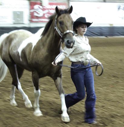 Haven Craig runs her horse Jack to their place in the Horse Show on Sept. 6. Jack placed third in the Grand Champion Gelding division.