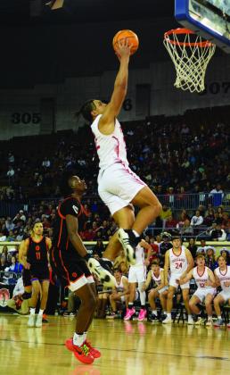 Caleb Hawkins adds two to the board on Mar. 8 in the Semifinals at the State Fair Arena.