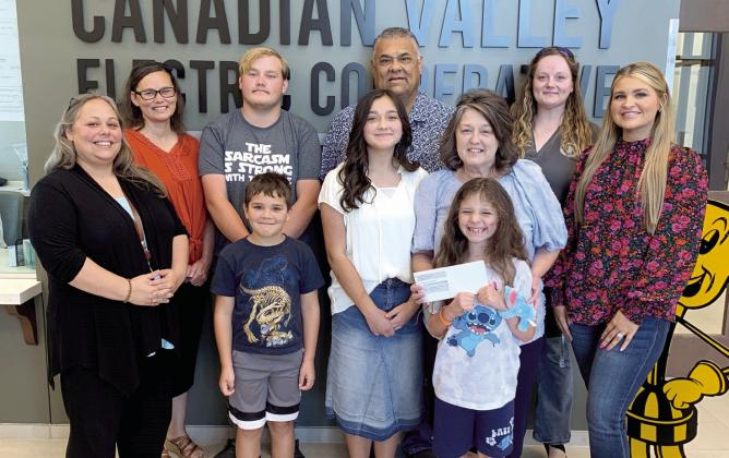 Members of the Praise Center are presented a $5,000 grant at the CVEC office. Photo provided