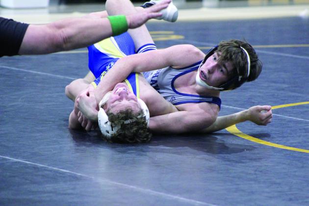 Shawnee's Blayne Taber gets confirmation from the referee of the pin of his Noble opponent during the dual meet on Jan. 25, held at the PAAC. Countywide &amp; Sun/Natasha Dunagan