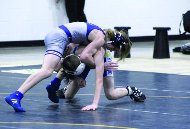 Shawnee's Booker Dahlman, top, takes down Noble's Erhan Prior during the dual meet on Jan. 25, held at the PAAC. Countywide &amp; Sun/Natasha Dunagan