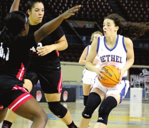 Bethel junior Parker Stevenson dribbles her way around two Idabel players during the Class 3A State Tournament Quarterfinal game on March 9. Stevenson joined the 1000-Point Club on Jan. 21, and in three seasons, has already put up 1,252 points. Countywide &amp;amp; Sun/Natasha Dunagan