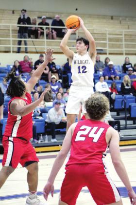Bethel’s John Gordon sinks a shot during the Dec. 9 game against McLoud in the first round of the First United Bank Classic in Bethel. Gordon reached 1000 points on Feb. 15 and ends the season with 1,069 points. Countywide &amp;amp; Sun/Natasha Dunagan